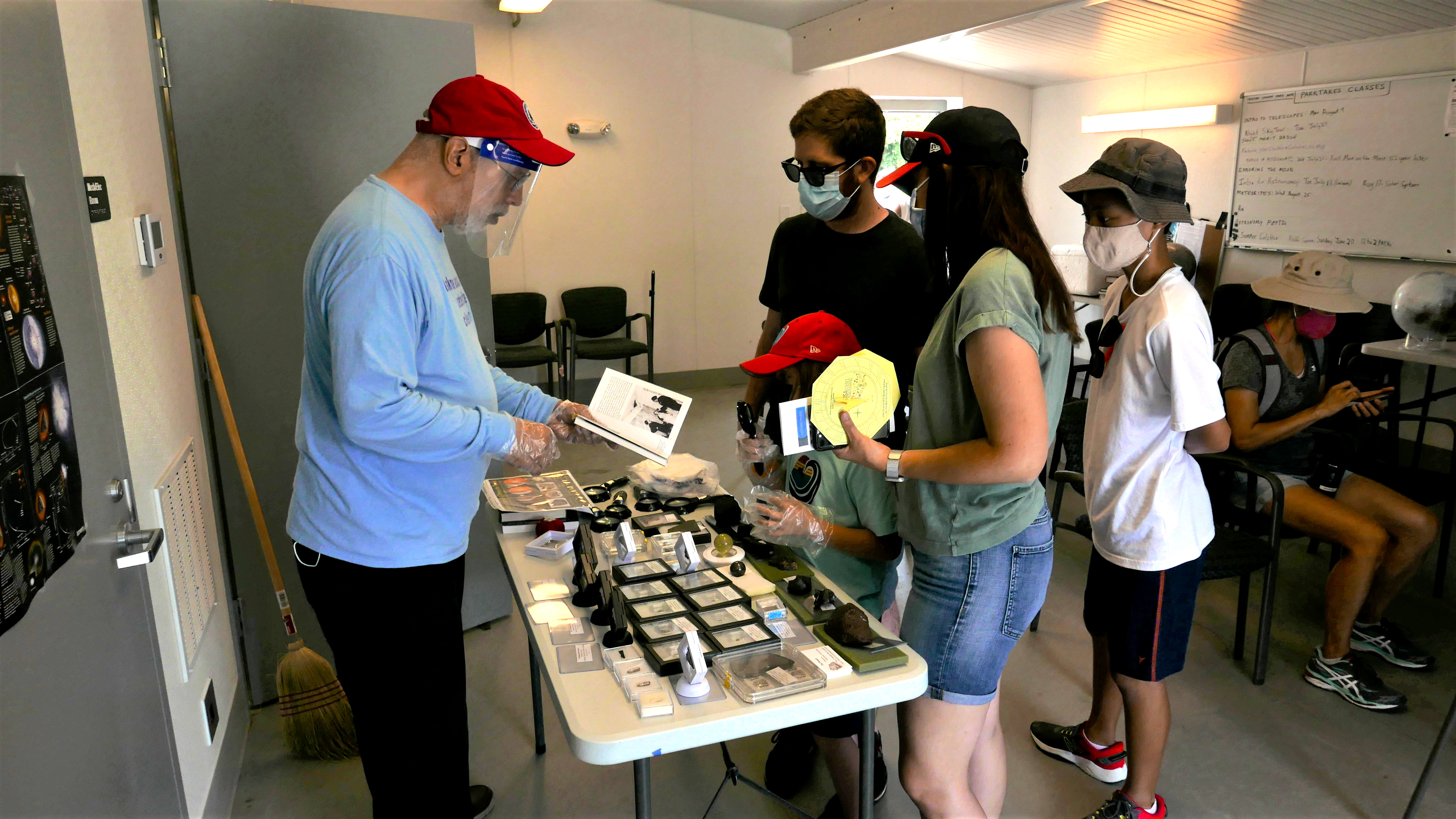 Summer Solstice 2021 Cal Powell at Meteorite Table with Visitors