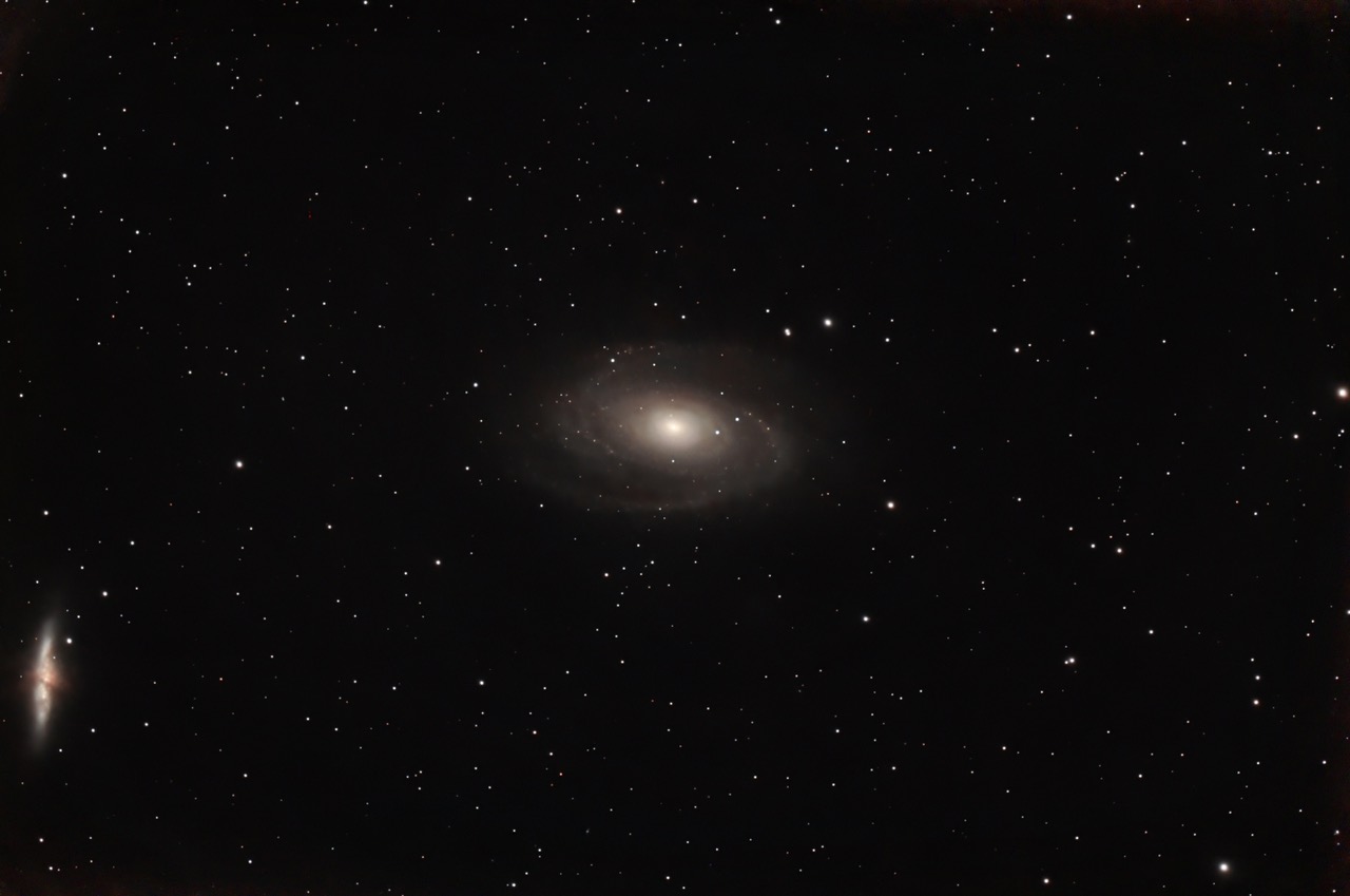 Bode’s Galaxy (Messier 81, center) and the Cigar Galaxy (Messier 82), a famous pair of interacting neighboring galaxies located about 12 million light-years away in the constellation Ursa Major. Discovered by Johann Elert Bode in 1774.